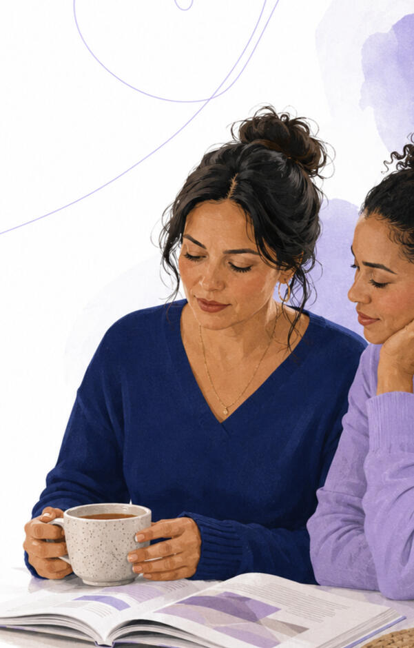Two women reviewing addiction guidance together at a table